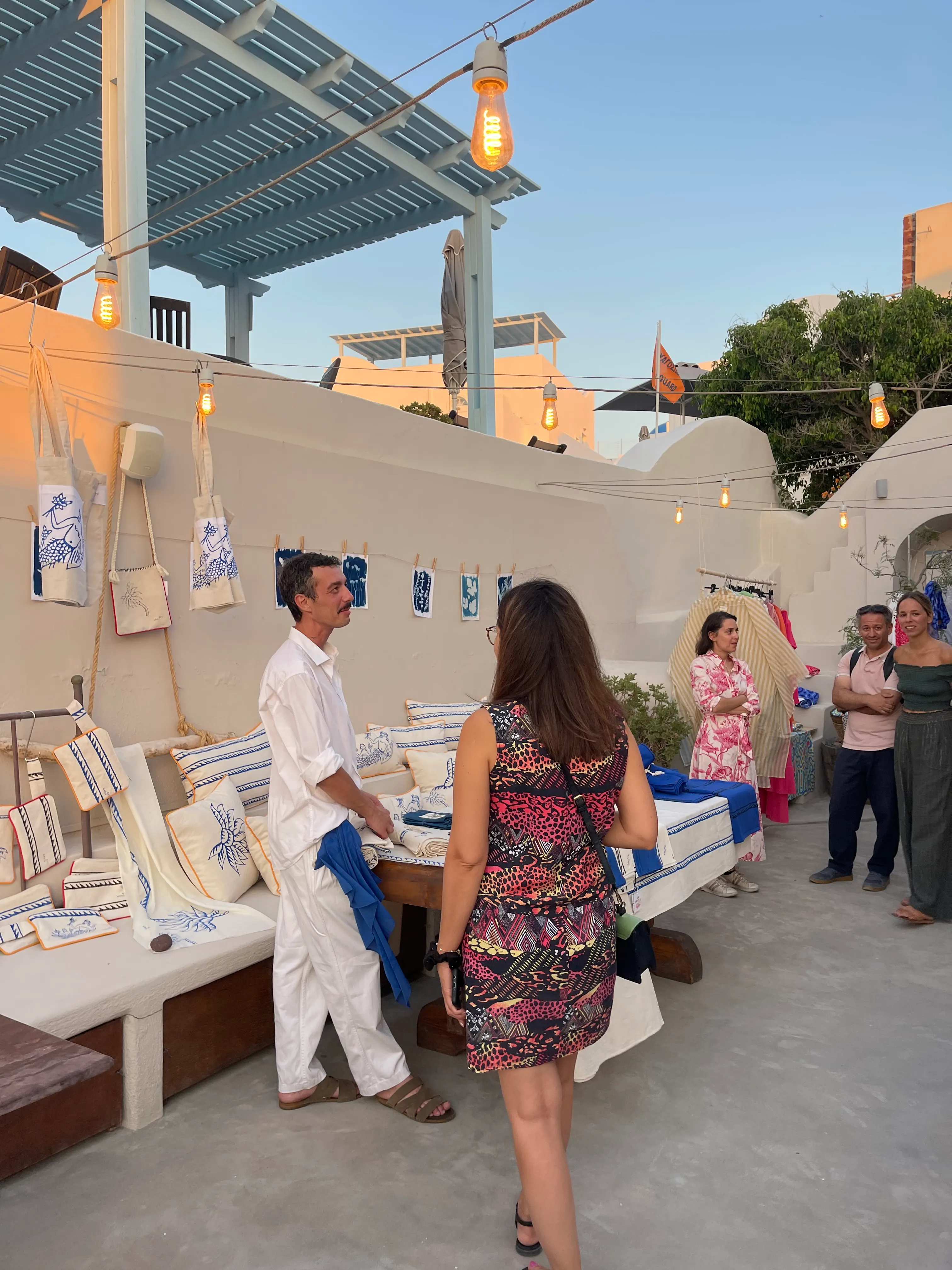 A creative exhibition gathering in the Oia Oenosart courtyard